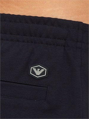 Pantaloni uomo Emporio Armani modello jogger in tessuto punto Roma blu in UOMO