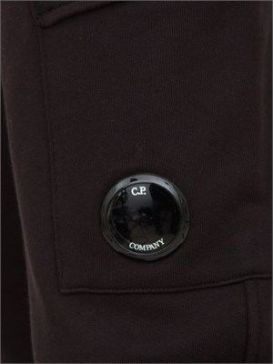 Pantaloni sportivi uomo C.P. Company in cotone nero con tasca cargo con lente in UOMO