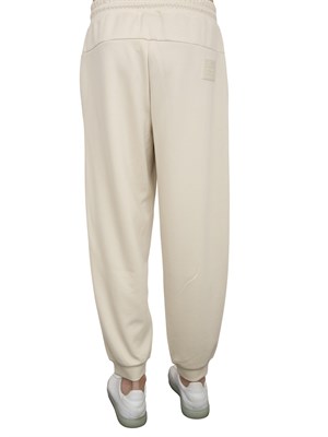 Pantaloni jogger EA7Core Identity Unisex in misto viscosa stretch avorio in UOMO