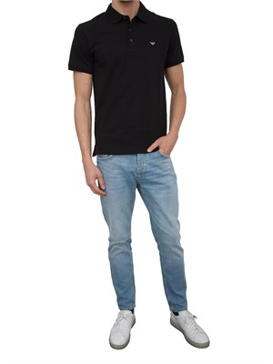 Polo nera Emporio Armani con patch logo in UOMO