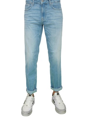 Jeans uomo Guess Jeans modello slim cinque tasche con lavaggio chiaro in UOMO