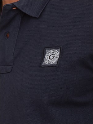 Polo uomo Guess Jeans in piquet di cotone blu con logo ricamato in UOMO