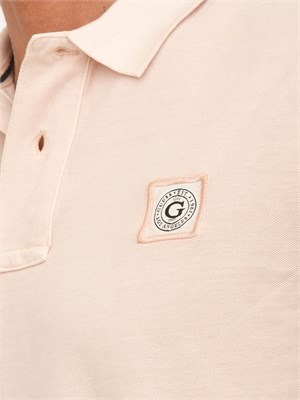 Polo uomo Guess Jeans in piquet di cotone rosa con logo ricamato in UOMO