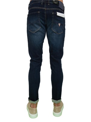 Jeans uomo slim Guess Jeans con lavaggio scuro effetto used in UOMO