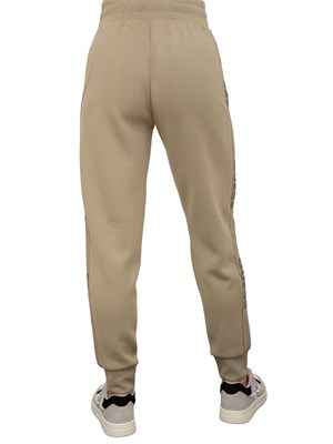 Pantaloni jogger verdi Guess Jeans donna con banda logo laterale in DONNA