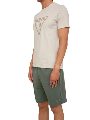 T-shirt uomo Guess Jeans in cotone beige con maxi logo davanti in UOMO