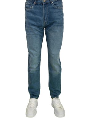 Jeans uomo Guess Jeans con lavaggio medio effetto used e vita media in UOMO