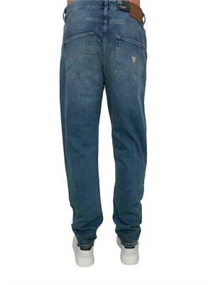 Jeans uomo Guess Jeans con lavaggio medio effetto used e vita media in UOMO