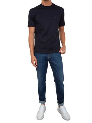 Jeans blu Corneliani uomo con lavaggio scuro ed  effetto used in UOMO