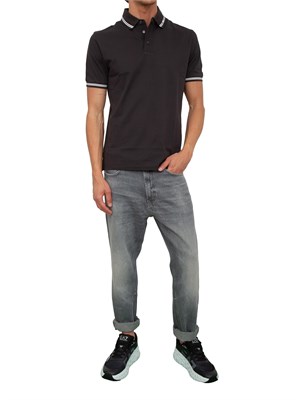 Polo nera Emporio Armani uomo con collo e maniche profilate a contrasto in UOMO
