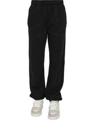 Pantaloni jogger Pinko in cotone nero effetto old con logo in tono in DONNA