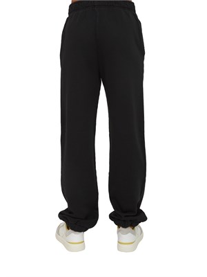 Pantaloni jogger Pinko in cotone nero effetto old con logo in tono in DONNA