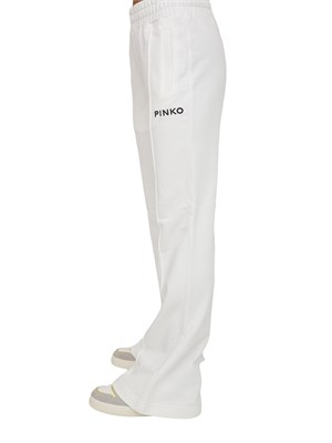 Pantaloni jogger Pinko modello flare in morbido cotone bianco e logo a contrasto in DONNA