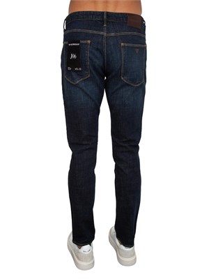 Jeans uomo Emporio Armani in cotone blu scuro e sabbiature in UOMO