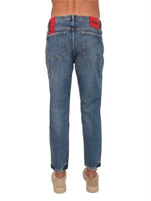 Jeans HUGO Uomo in denim medio effetto used in UOMO
